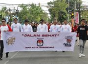 Sosialisasikan Pilkada Lewat Jalan Sehat