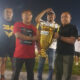 Kepala Dispora Provinsi Gorontalo, Danial Ibrahim ketika menyerahkan piala kepada juara pertama pada Turnamen Sepak Bola U-40 KNPI Tapa.