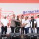 Semarak Merah Putih Kemerdekaan BRI Region 6 Meriahkan Pasar Malaka Rorotan, Dibuka dengan Simbolis Penumbukan Padi